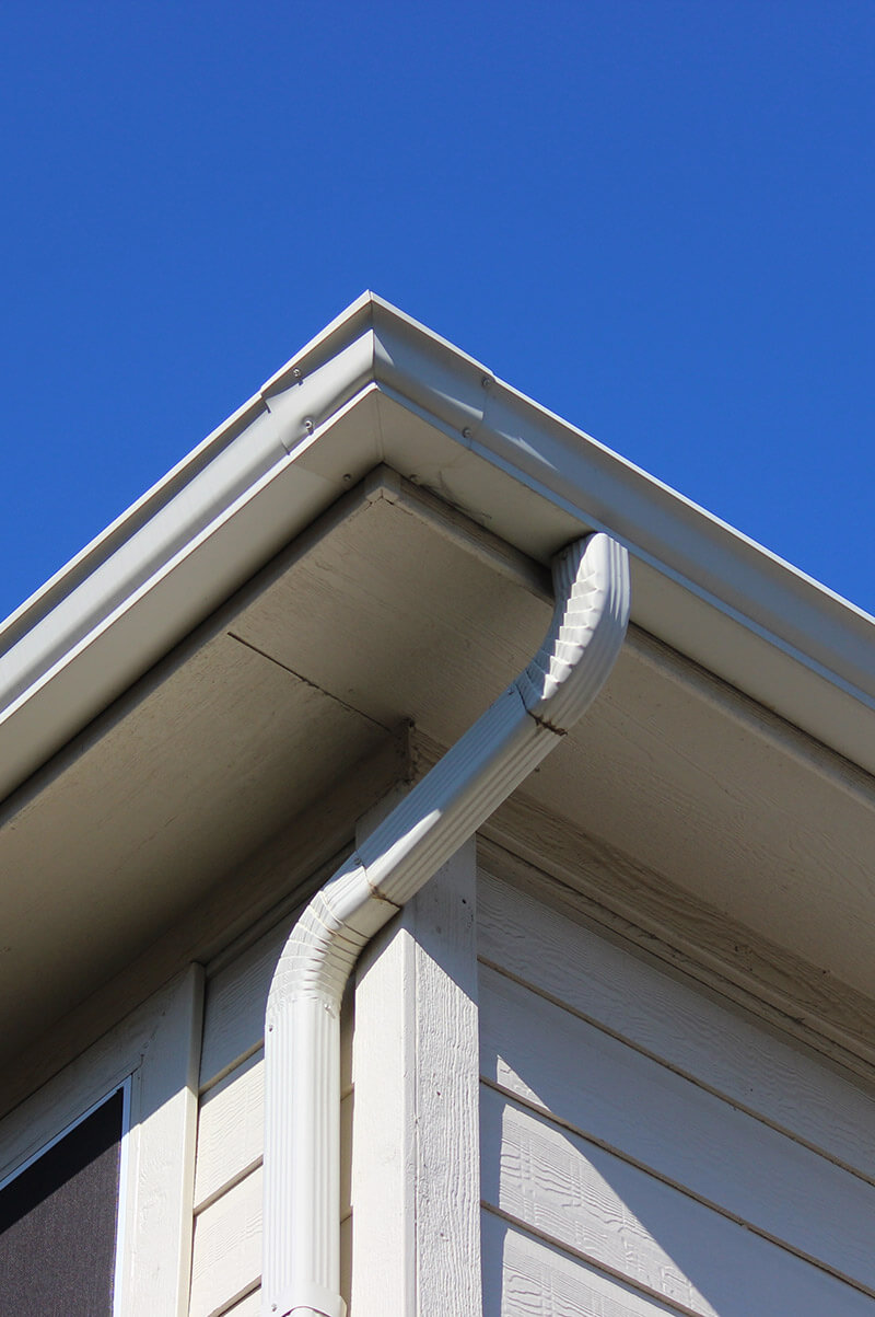 view of a gutter guard system on a residential house