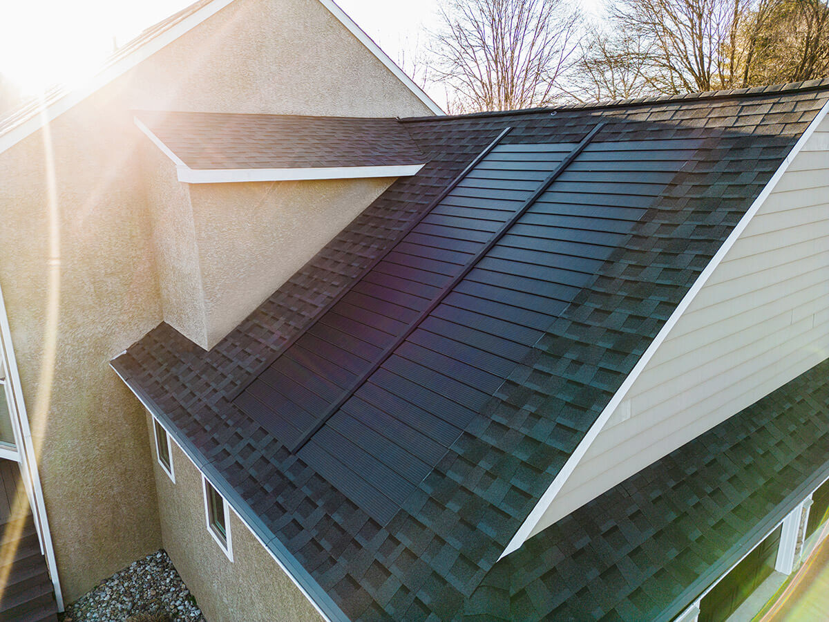 view of solar shingles on top of a house