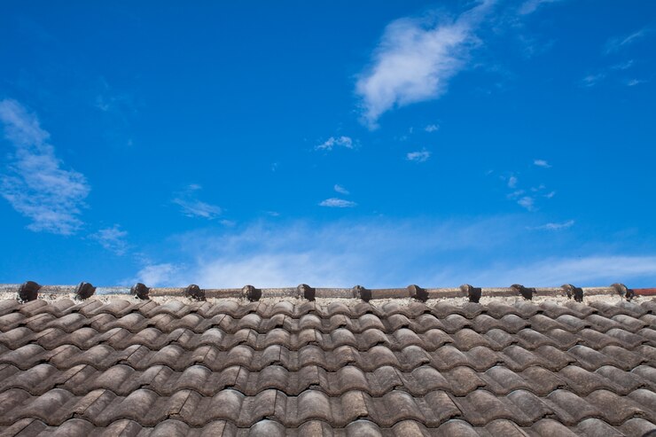 Tiled roof with blue sky background